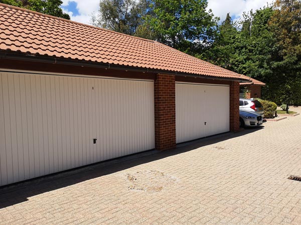 Painting Garage Doors on Block of Flats in Sandbanks - After Photo - Frampton and Sons Bournemouth